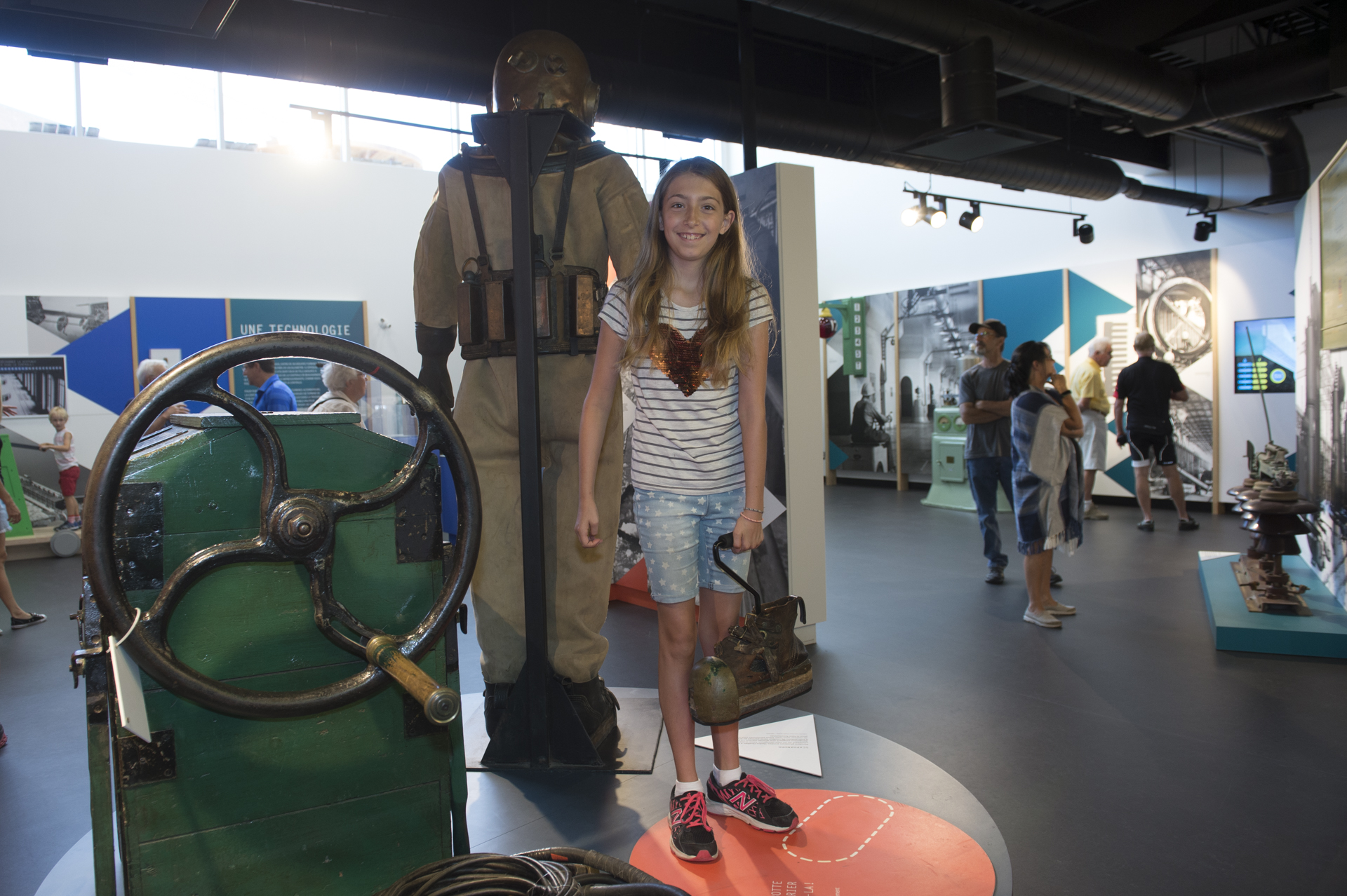 A child in front of a former diving suit on display at the interpretation centre. 
