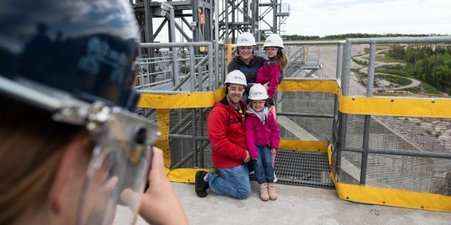 Family photo at Romaine-1 generating station.